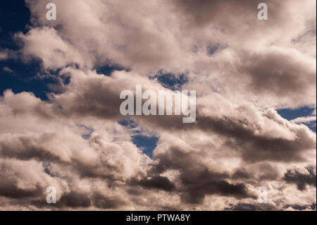 Altocumulus undulatus clouds making for a dramatic sky. Stock Photo