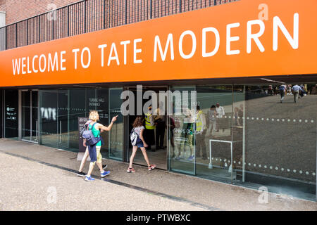 London England,UK,Southwark,Bankside,Tate Modern,contemporary art museum gallery,entrance door,welcome sign,exterior outside,woman female women,girl g Stock Photo