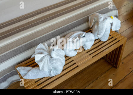 Peru, South America.  Towel-folding art creations of a snail, crab and elephant. Stock Photo