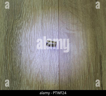 cartridge case a gun on the gray floor, close-up Stock Photo