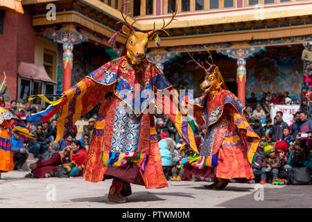 Dancing buddhist mask festival at Matho monastery in Ladakh, India. Monks performing dances to teach the people about buddhism and life Stock Photo