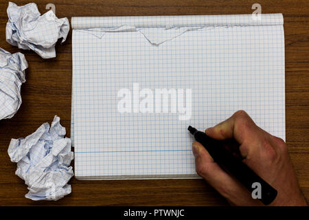 Business Empty template for Layout for invitation greeting card promotion poster voucher. Man holding marker notebook crumpled papers ripped pages mis Stock Photo