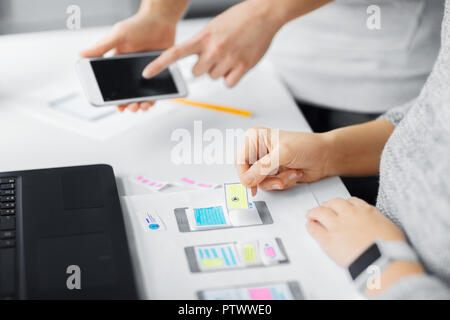 web designers creating mobile user interface Stock Photo