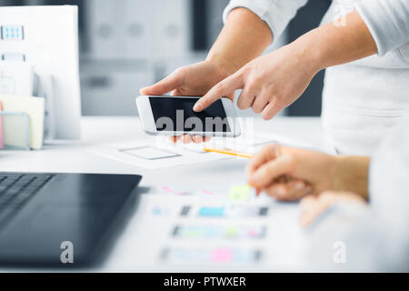 web designers creating mobile user interface Stock Photo