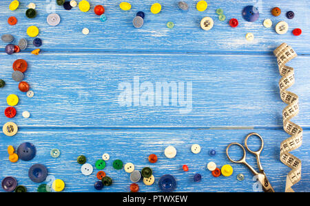 Composition of buttons on a blue wooden background Stock Photo