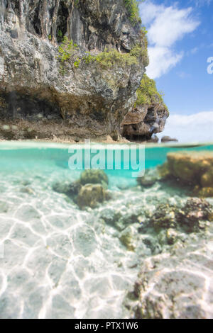 Split shot underwater photograph of Niue Island's coastline Stock Photo