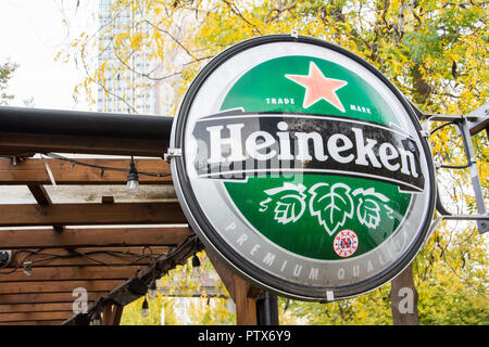 Dutch brand Heineken red star beer signage and logo outside a cafe at Gabriel's Wharf, London, UK Stock Photo