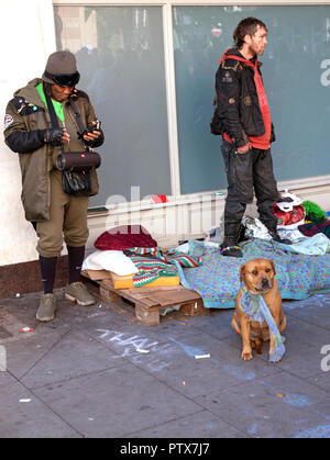 Street people with their dog in Brighton Stock Photo