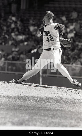1970s, professional baseball player in action at a Major League Baseball (MLB) game, USA. Photo shows a 'pitcher' on his mound- a small artificial hill - about to throw (or pitch) the ball towards the catcher. Stock Photo