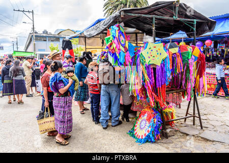 Santiago Sacatepequez, Guatemala - November 1, 2017: Selling kites during giant kite festival honoring spirits of the dead on All Saints Day. Stock Photo