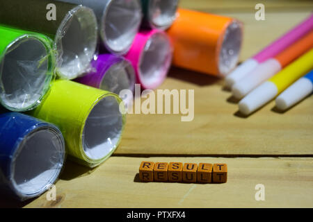 Result on wooden cubes with colorful paper and pen, Concept Inspiration on wooden background Stock Photo