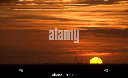 Sunset over the offshore Colwyn Bay Windfarm on the North Wales coast Stock Photo
