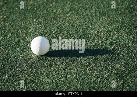 White dimple hockey ball on astro turf Stock Photo