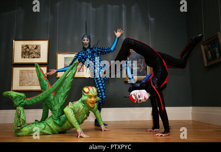 Perfromers from the current Cirque du Soleil show OVO (from left) Weiliang Wu 'The Cricket', Jan Dutler 'The Foreigner' and Alanna Baker 'Black Spider', during a visit to the National Gallery of Ireland to view the Gallery&Otilde;s exhibition Circus250: Art of the Show. Stock Photo