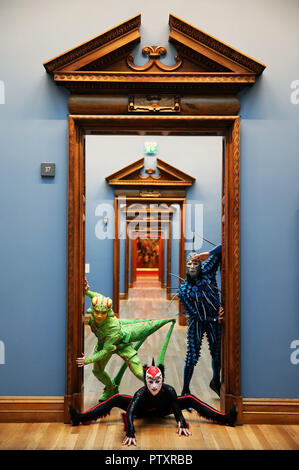 Perfromers from the current Cirque du Soleil show OVO (from left) Weiliang Wu 'The Cricket', Alanna Baker 'Black Spider' and Jan Dutler 'The Foreigner', during a visit to the National Gallery of Ireland to view the Gallery&Otilde;s exhibition Circus250: Art of the Show. Stock Photo