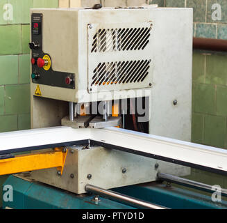 Production of pvc windows, gluing of plastic corners of windows, machine for the production of pvc windows, profile Stock Photo