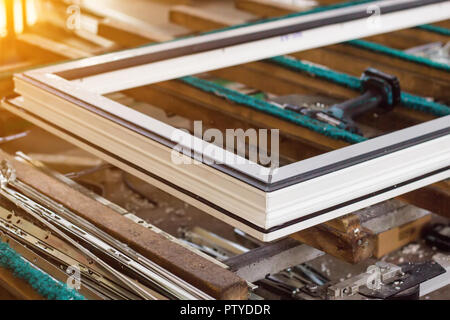 Production of pvc windows, pvc window sash, frame and tools for manufacturing, window frame Stock Photo