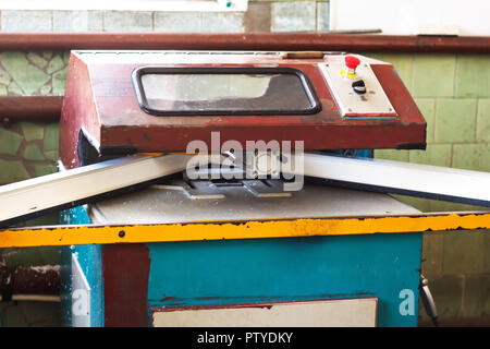 Production of pvc windows, trimming of pvc frame, mechanical Stock Photo