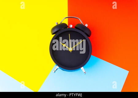 Clock on colorful background with selective focus and crop fragment. Copy space concept Stock Photo