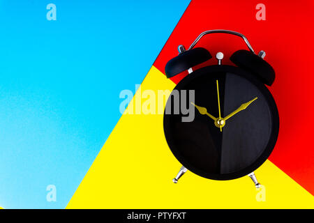 Clock on colorful background with selective focus and crop fragment. Copy space concept Stock Photo