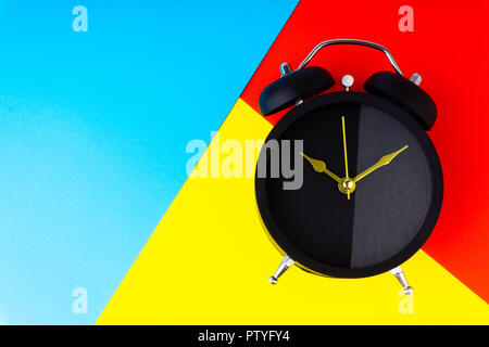 Clock on colorful background with selective focus and crop fragment. Copy space concept Stock Photo