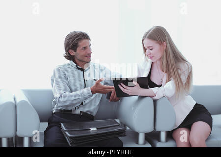 Two coworkers discussing their work, working with documents Stock Photo