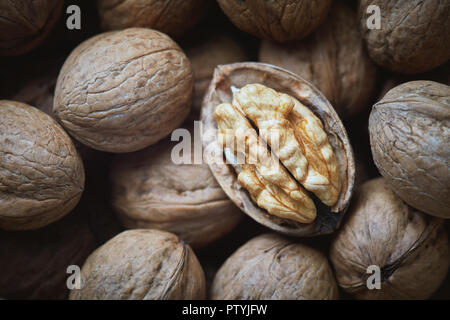 Closeup of whole and kernel walnuts. Top view Stock Photo