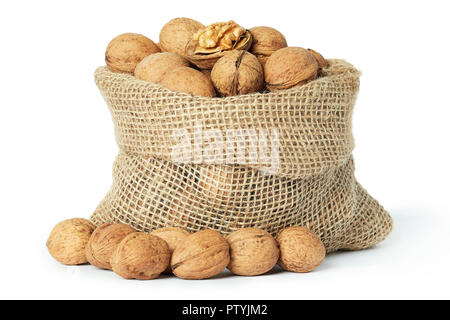 Whole walnuts (in shell) in burlap sack isolated on white background Stock Photo