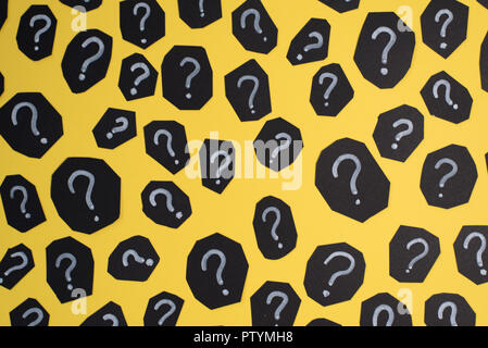 full frame image of black paper card with QUESTION MARK on yellow background. Concept of FAQ, Q&A, Problems and Questions background Stock Photo
