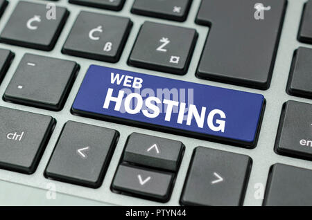 Blue Web hosting button on computer keyboard. Stock Photo