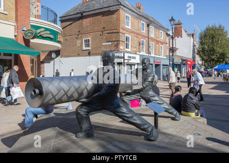 Statue of Lino Workers, High Street, town centre, Staines-upon-Thames, Surrey Stock Photo