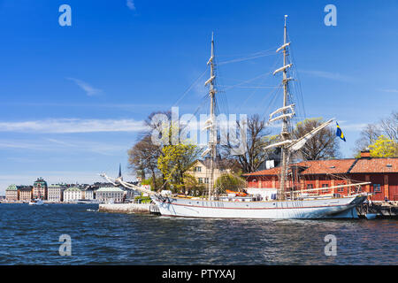 White sailing ship moored near Skeppsholmen island, one of the islands of Stockholm city, Sweden Stock Photo