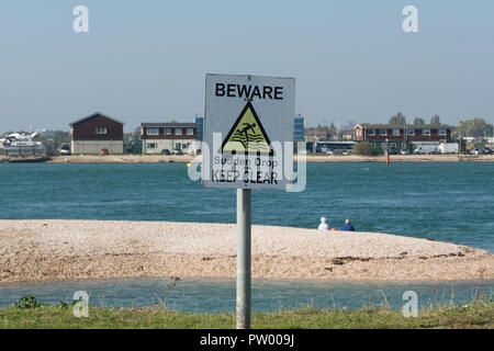 Sign by the sea warning people to Beware Sudden Drop Keep Clear Stock Photo