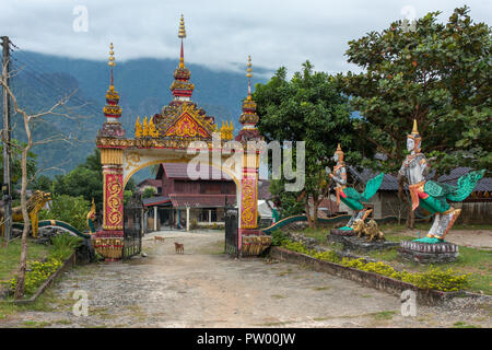 Entrance to the buddhist temple near Vang Vieng village in Laos Stock Photo