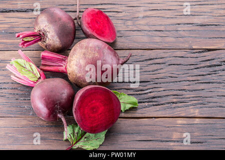 Red beets or beetroots on the wooden table. Stock Photo