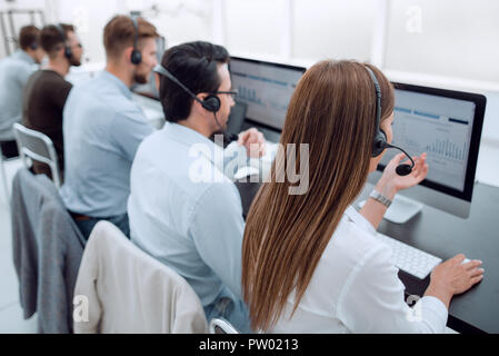 group of call center employees work with clients Stock Photo