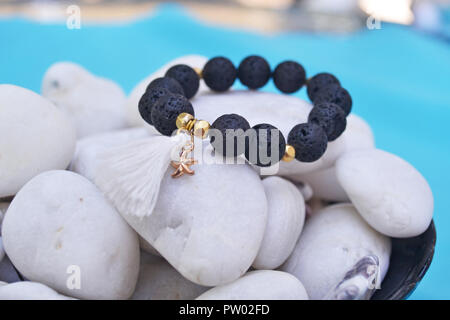stylish bracelet with black volcanic beads - semi precious stones jewelry Stock Photo