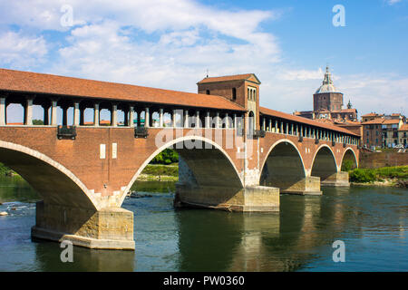 The Ponte Coperto (covered bridge), also known as the Ponte Vecchio (old bridge), a brick and stone arch bridge over the Ticino River in Pavia, Italy Stock Photo