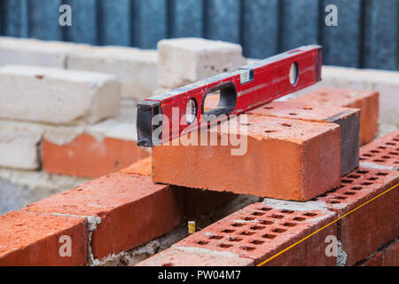 construction of  brick building building level on bricks Stock Photo