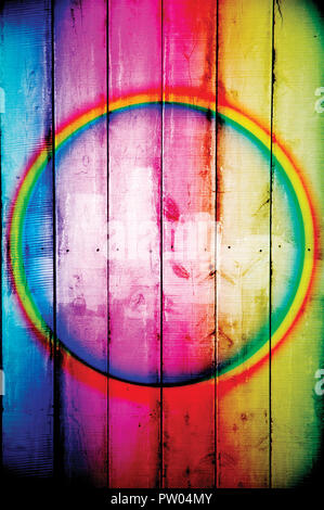 Bright rainbow colored fence or plank background with center circle Stock Photo
