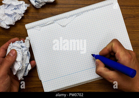 Design business concept Empty template copy space text for Ad website isolated. Man holding marker notebook crumpled papers ripped pages mistakes made Stock Photo