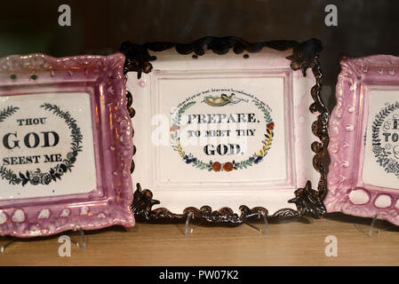 Display of Religious Ceramic Trays or Porcelain Tray with Slogan Prepare to Meet Thy God. Early c20th English Knick Knack or Bric-à-brac Stock Photo