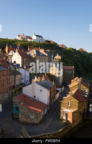 The beautiful historic village of Staithes on the coast of North Yorkshire, England. Cottages overlooking Staithes Beck. Stock Photo