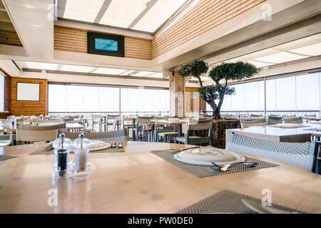 Interior of elegant restaurant with tables set for lunch Stock Photo