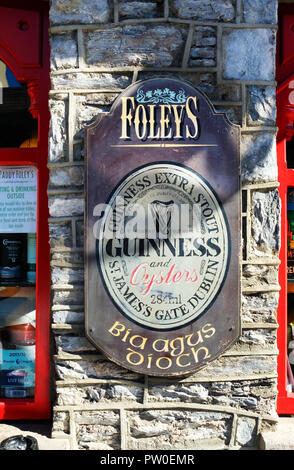 Typical Irish pub sign, Guinness and Fiddle, Lowery's pub, Clifden ...