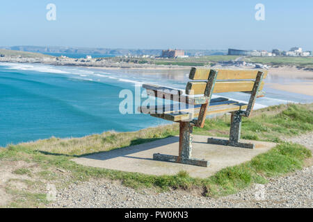 Bench seat overlooking the sands at Fistral, Newquay. Metaphor vacant space, empty seats during Covid in UK, 2021 staycation in UK. Stock Photo