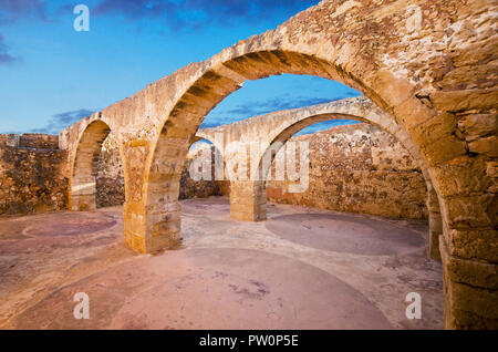 Rethymno town in Crete island, Greece. Old arched vault of Fortezza fortress. Stock Photo