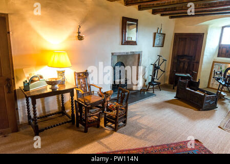 One of the rooms interior with an old baby cradle on a floor, Crathes Castle, Aberdeenshire, Scotland Stock Photo