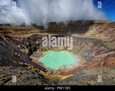 Ilamatepec lagoon on the active Santa Ana Volcano in El Salvador, beautiful mint green laguna in the volcano with clouds above and sulfur steam Stock Photo