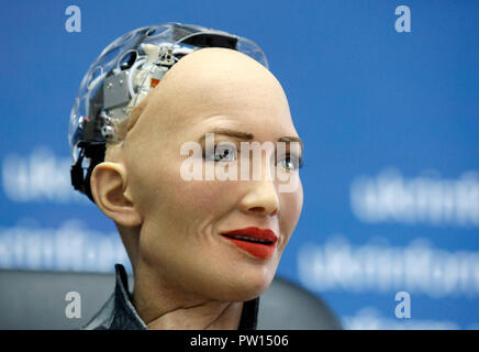 The humanoid robot Sophia speaks at a press conference in Kiev. The robot Sophia arrived to Ukraine to take part in the final of the all-Ukrainian competition of developers of robotics and artificial intelligence (AI) as jury member and meeting with Ukrainian Prime Minister Volodymyr Groysman. Humanoid robot Sophia was granted citizenship in Saudi Arabia, making her the first robot in the world to receive citizenship. Stock Photo